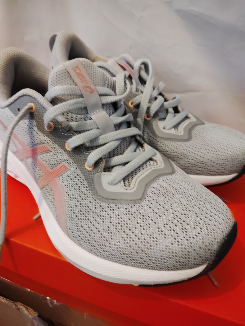 ASICS Women's Light Gray Running Shoes with Pink Accents